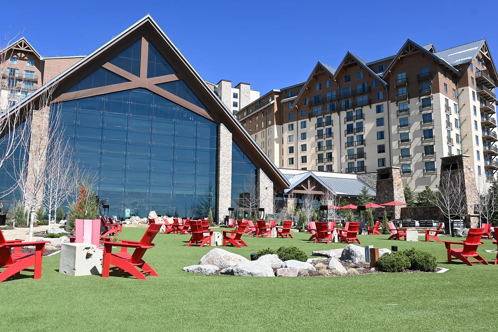 The glass west atrium and lodge-style hotel wings of Gaylord Rockies Resort in Aurora, Colorado