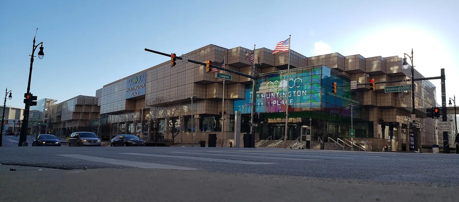 Huntington Place convention center in Detroit, with its 'Huntington Place' signage on the glass corner