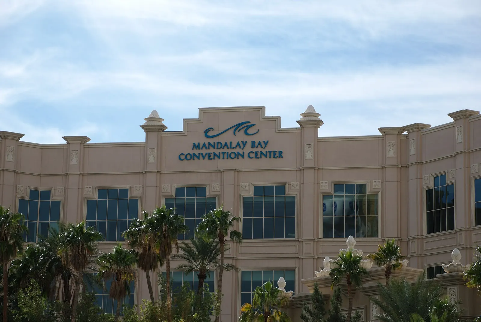 The facade of the Mandalay Bay Convention Center with its name and wave logo