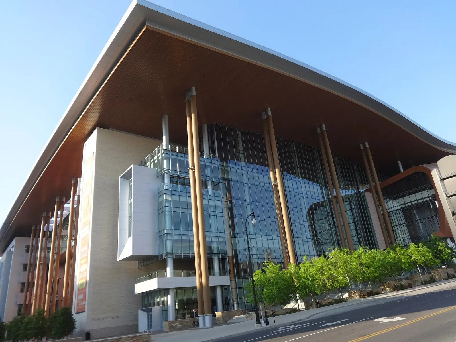 The wave-shaped roof and glass facade of the Music City Center in Nashville